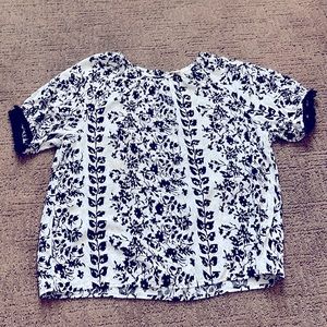 Black/white top with gold accents